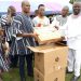 Bole- Bamboi MP presents computers for community library.