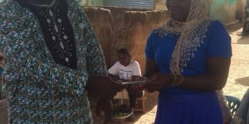 Jaksally Shares out annual village savings and loans association (VSLA) to Members at Bole.