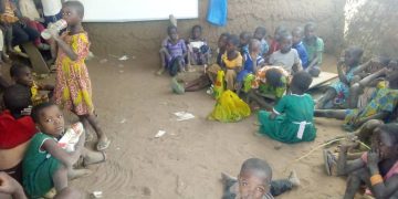 Pupils of Tampoi R/C Primary Lie On Bare Floor To Learn.
