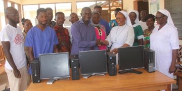 Hon. Seidu Nuhu Banasco donates computers to Nakwabi health center.