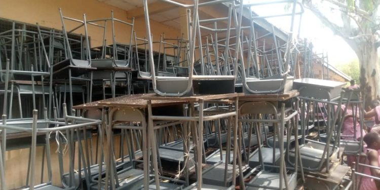 Deputy minister of lands and natural resources hands over furniture to Bole SHS