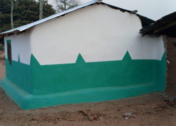 Apostle Dr. Moses Konjon Sansa rehabilitates a room for a visually impaired widow.