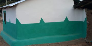 Apostle Dr. Moses Konjon Sansa rehabilitates a room for a visually impaired widow.