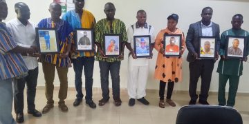 Presiding Member honours past and present DCEs with photo portraits.