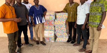 Ernest Botah donates 2,000 exercise books to schools in Sawla -Tuna- Kalba District.